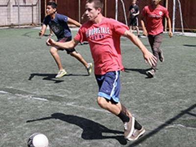 Male Student Playing Soccer