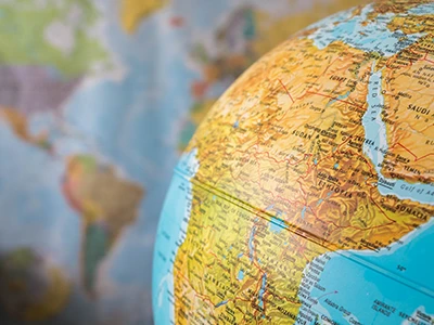 Globe with a calendar in the background